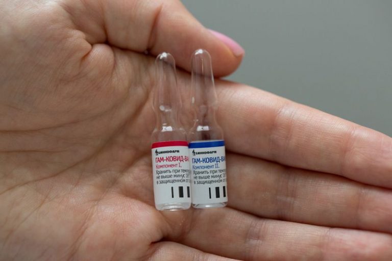 LYNXMPEG8312H.jpg,FILE PHOTO: A handout photo shows an employee demonstrating vials with  LYNXMPEG8312H.jpg,FILE PHOTO: A handout photo shows an employee demonstrating vials with